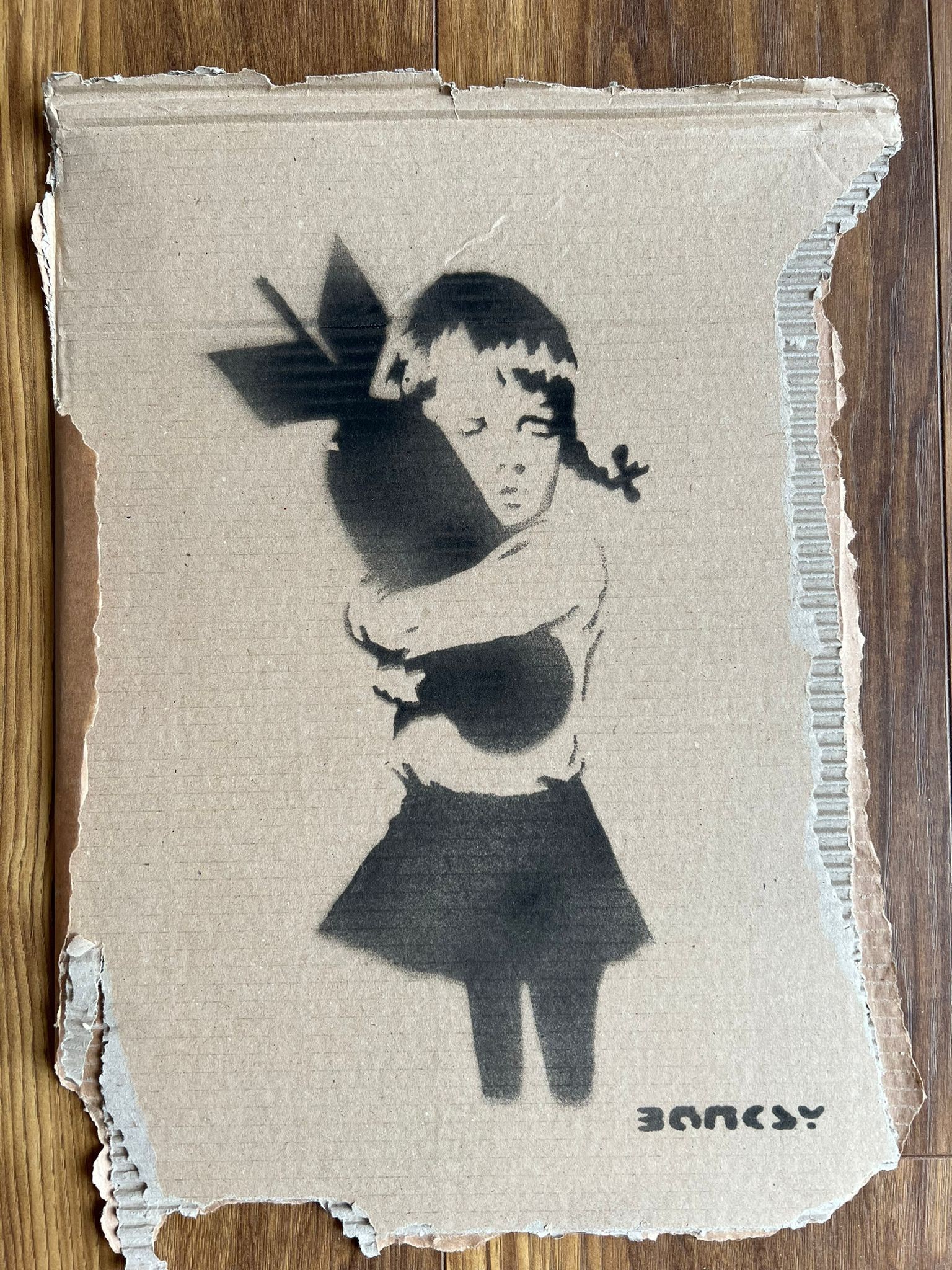 Bomb Hugger' Cardboard by Banksy - Dismaland Souvenir - CharityStars