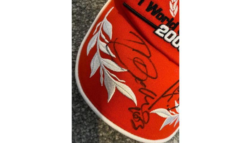 Ferrari Cap 2003 - Signed by Barrichello and Schumacher - CharityStars