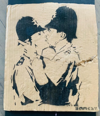 'Kissing Coppers' Cardboard by Banksy - Dismaland Souvenir