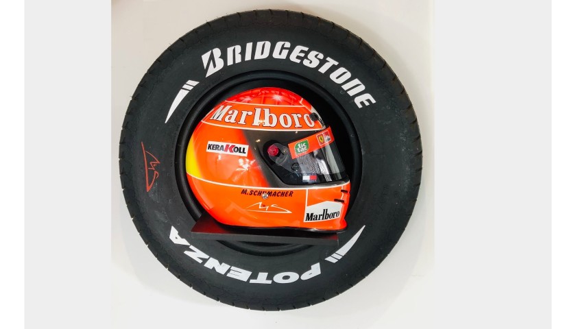 Display pneumatico e casco Ferrari + autografo Schumacher - CharityStars