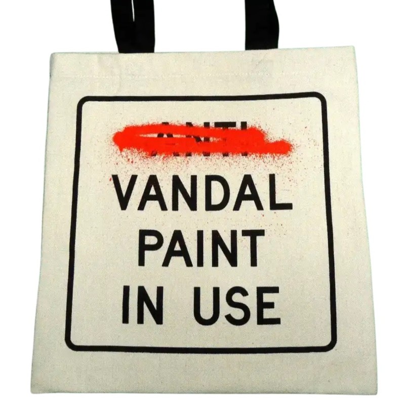 "Anti Vandal Paint in Use (Tote Bag - Cut and Run)" by Banksy