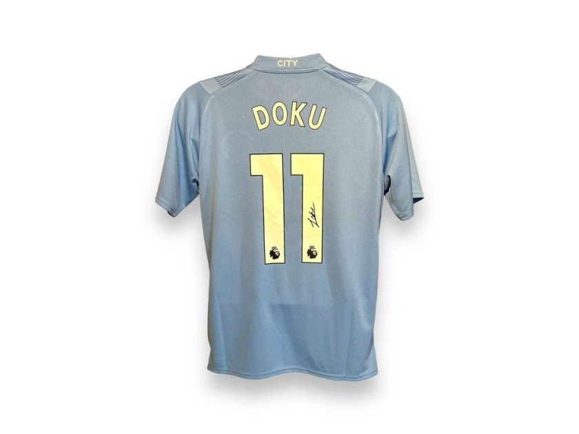 Maglia ufficiale firmata da Jeremy Doku per il Manchester City 2023/24