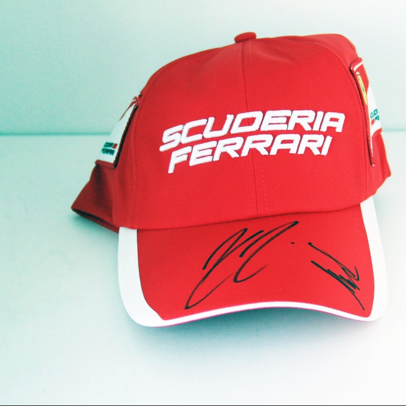 Ferrari hat signed by Raikkonen and Arrivabene