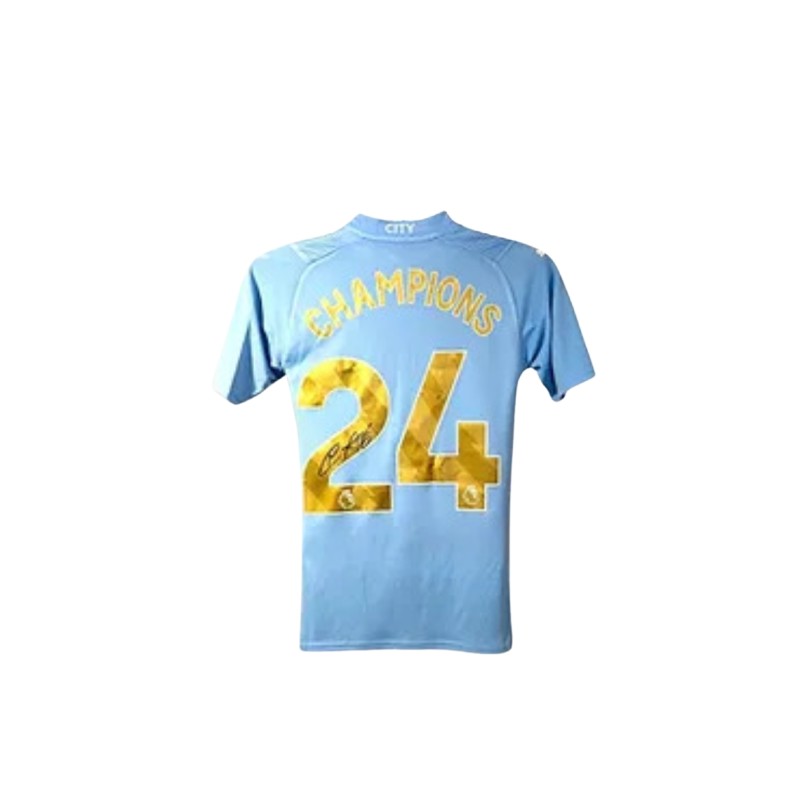 Maglia ufficiale Champions firmata da Nathan Aké per il Manchester City 2023/24