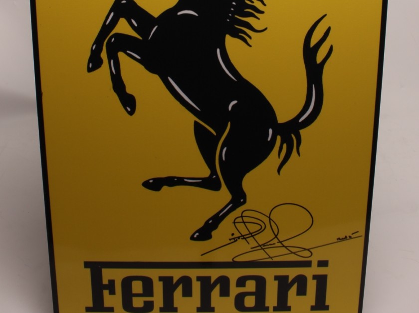 Ferrari Logo Signed by John Surtees, Jody Scheckter and Nigel Mansell