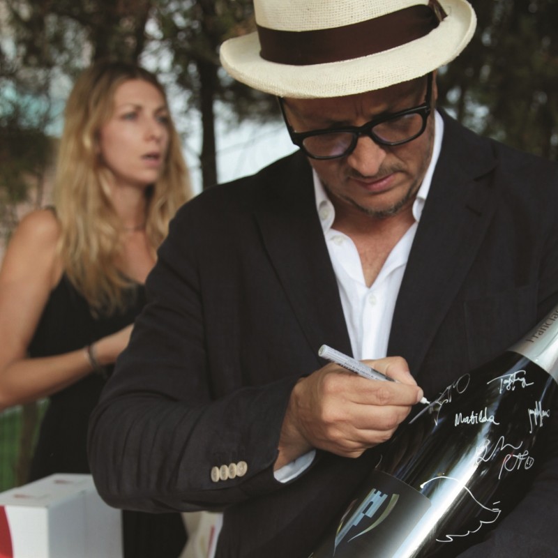Franciacorta factice bottle signed by actors and directors during Mostra del Cinema in Venice 2016