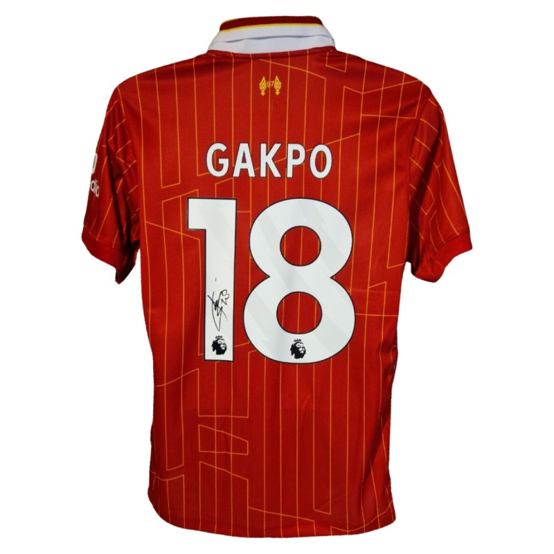 Cody Gakpo firma la maglia da calcio ufficiale del Liverpool 2025-26