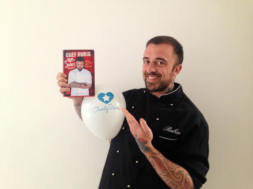 Chef Rubio gives you the first copy of his book and his chef uniform