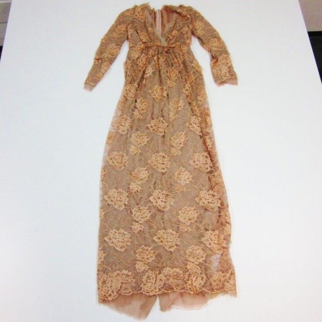 Long dress made of old-rose lace by Dolce&Gabbana worn by Franca Sozzani