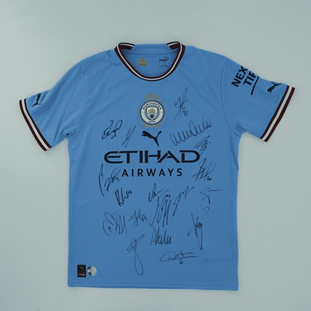 Maglia ufficiale autografata del Manchester City 2022/23, vincitore del Treble