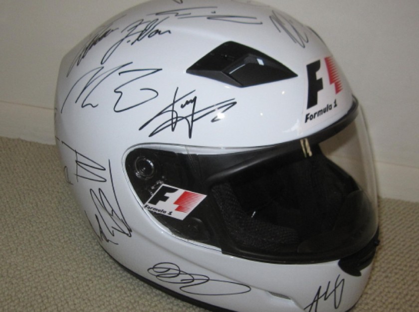 F1 Drivers Helmet Signed by 42 F1 Champions and F1 Opus 
