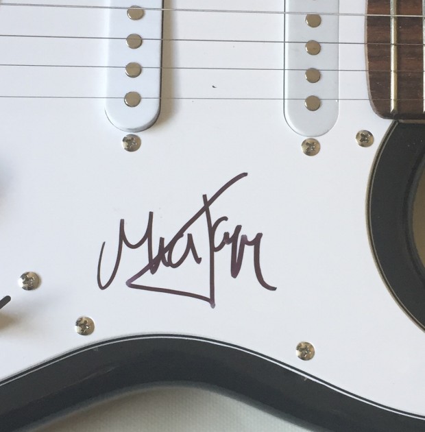 Guitar signed by Mick Jagger
