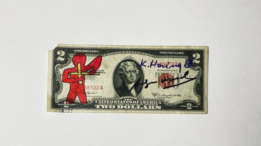 Due dollari firmati e disegnati a mano da Keith Haring e Andy Warhol