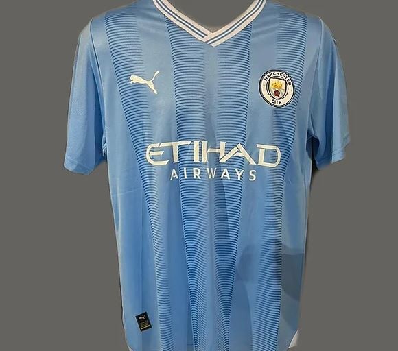 Nathan Aké's Manchester City 2023/24 Signed and Framed Shirt - CharityStars