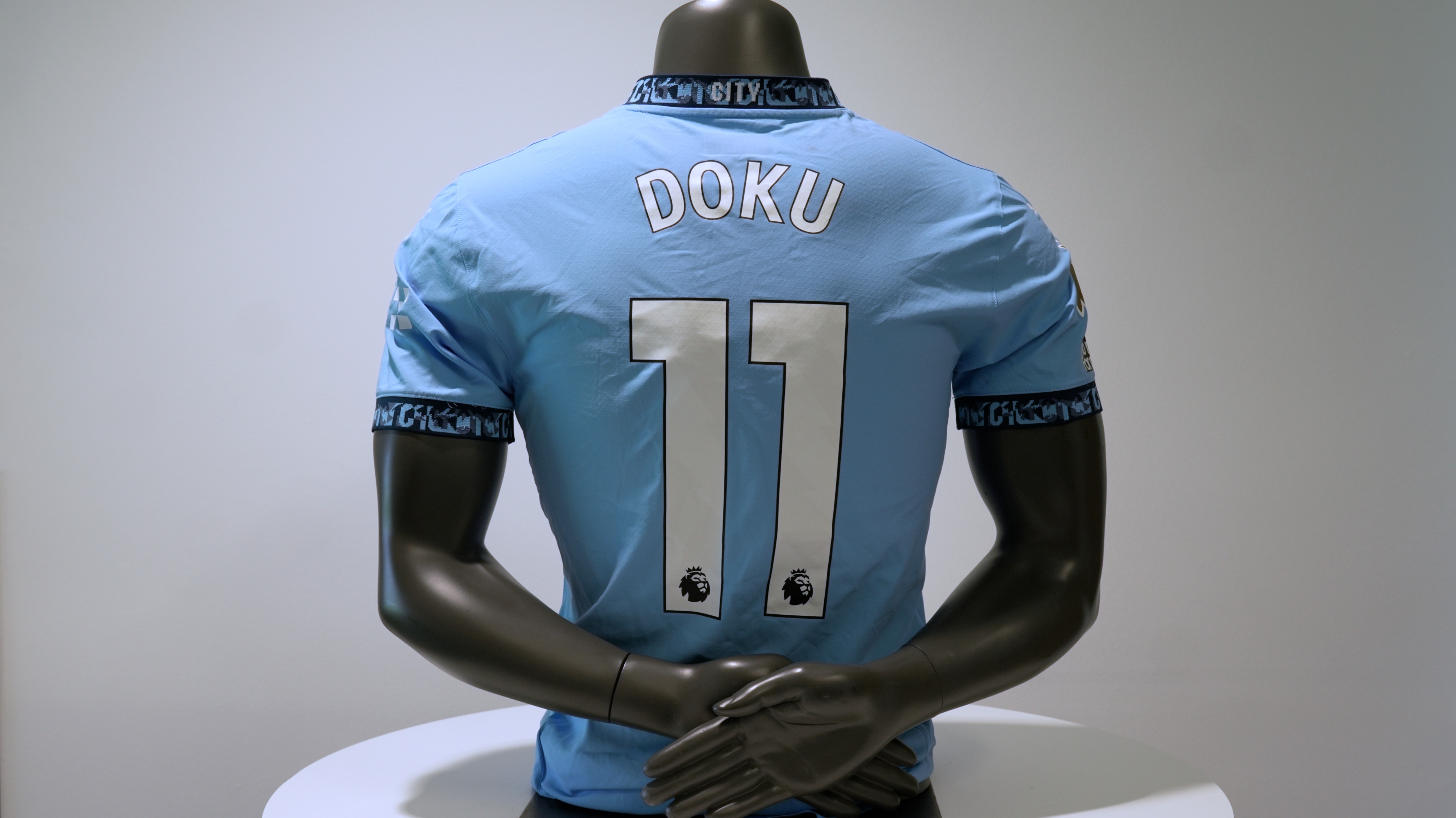 Jermey Doku's Match Worn & Signed Shirt from Manchester City v