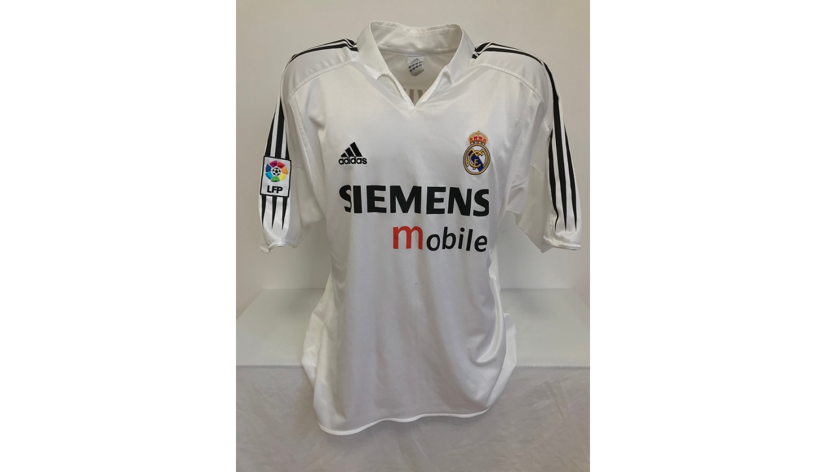 A Glazed and Framed Signed Real Madrid Shirt 2004