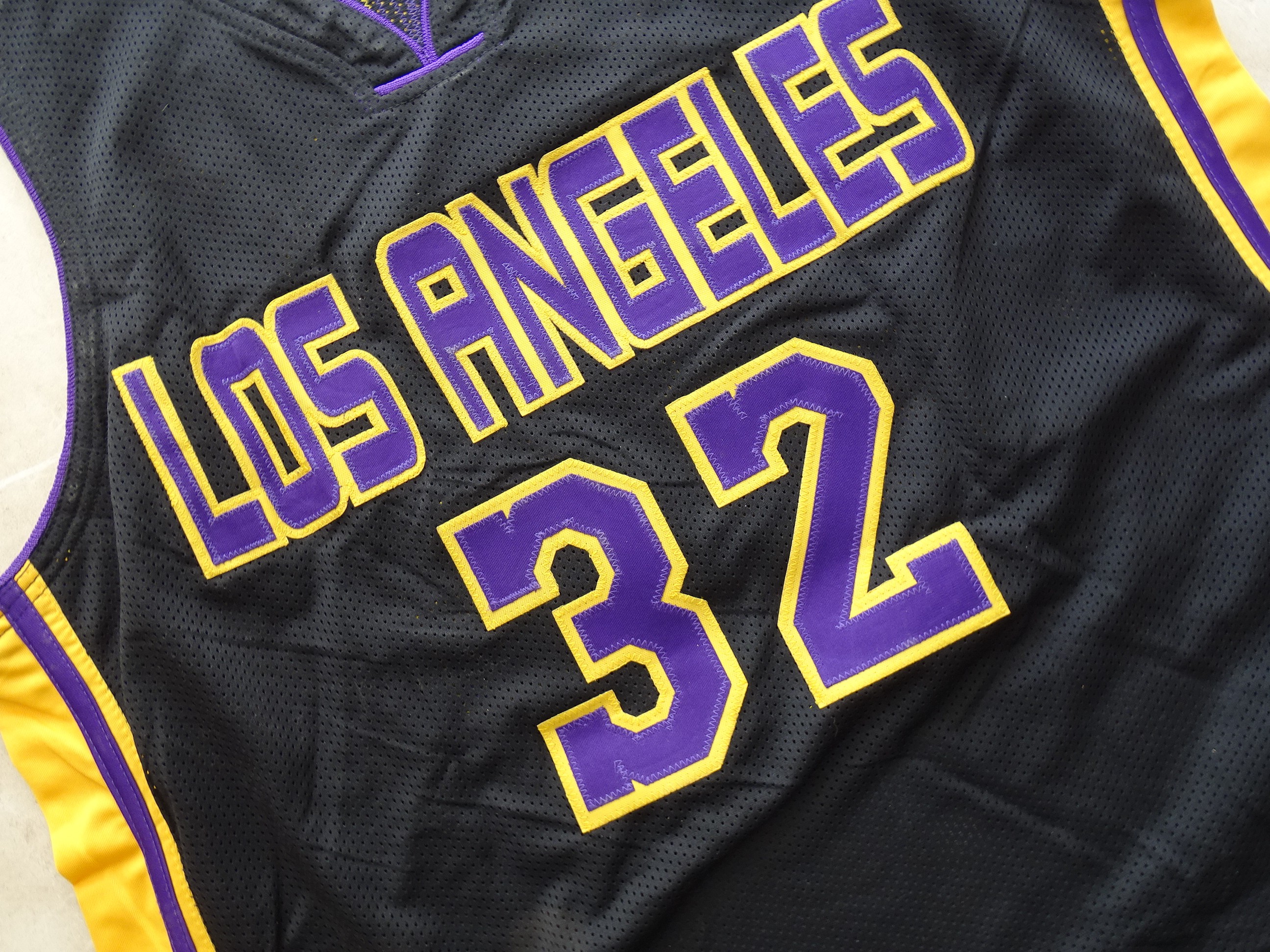 Black Lakers Jersey Signed by Magic Johnson - CharityStars