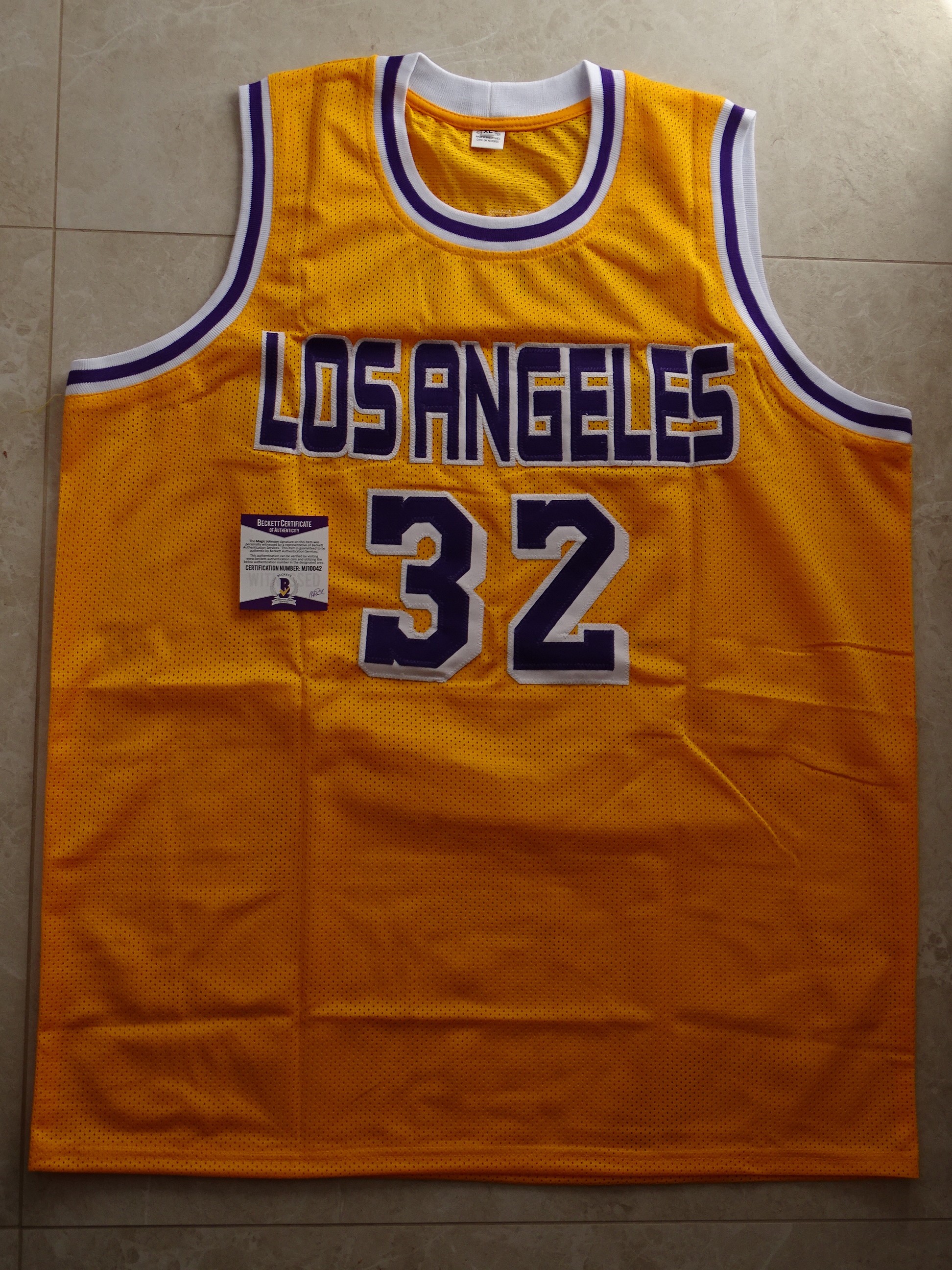 Magic Johnson's Official LA Lakers Jersey - Signed by Johnson and Bryant -  CharityStars